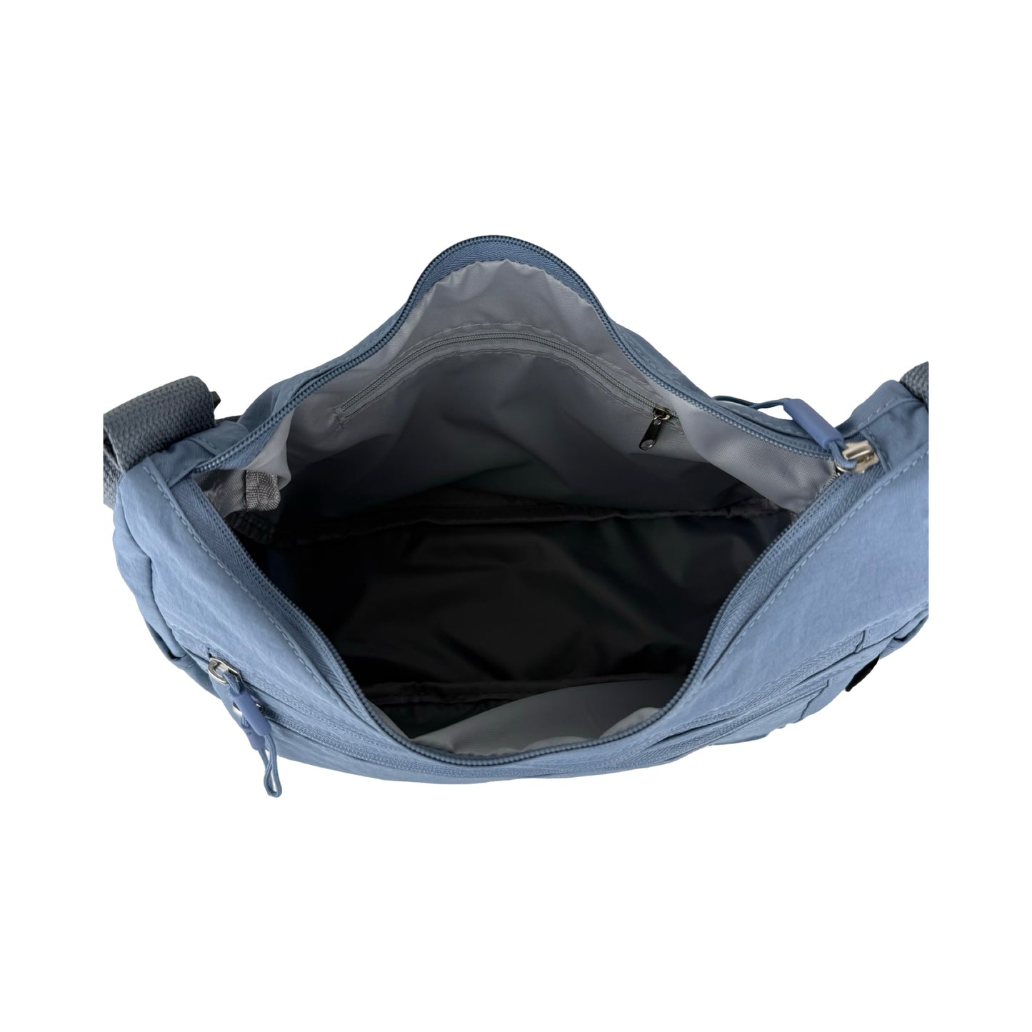 Indvendigt billede af Asta skuldertaske i lyseblå med åben lynlås viser rummeligt indhold