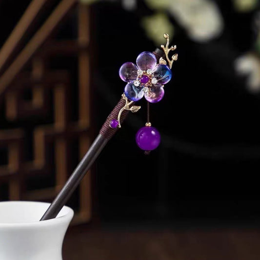 Elegant hårnål med lilla blomst og perle